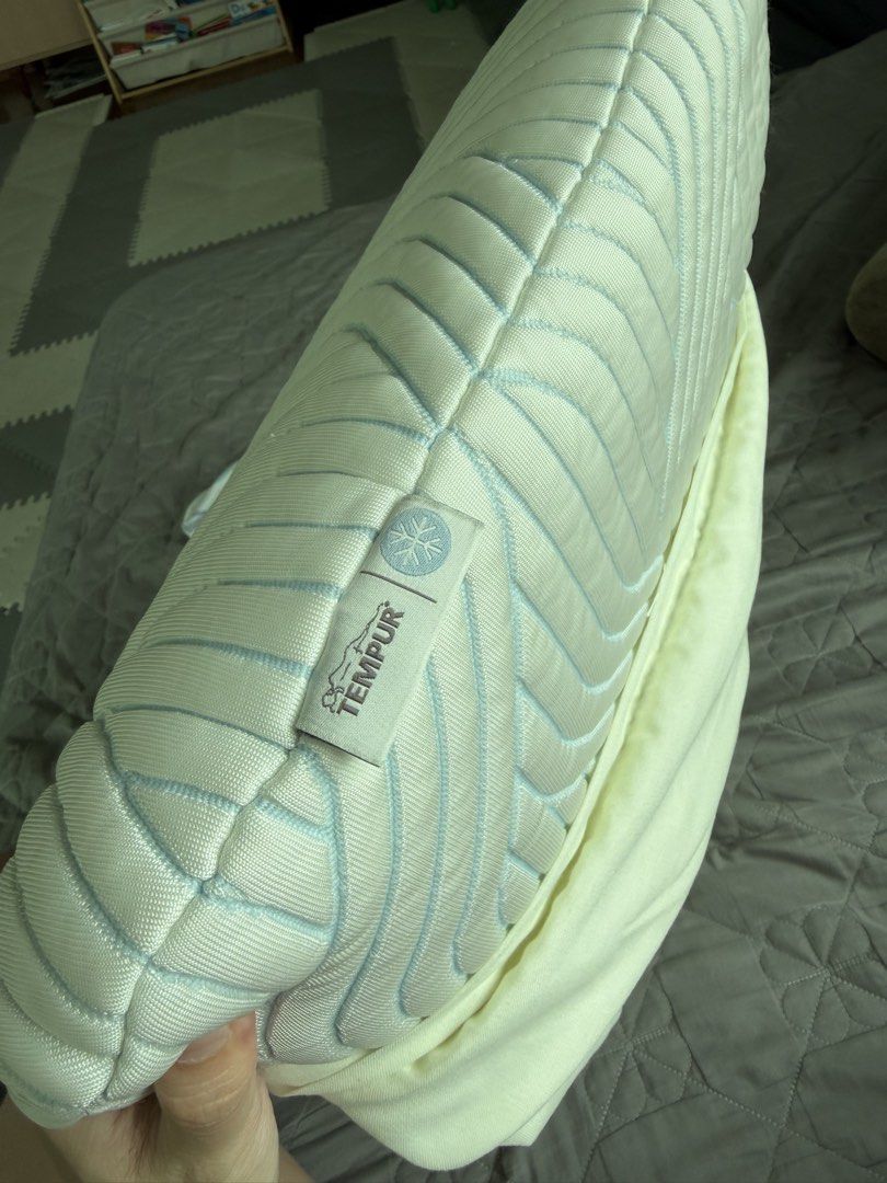 TEMPUR Memory Foam Pillow (Category: Bedding & Towels) located in Manila. Submitted by kristielyntan (Listing ID 1461130233, Image 3). Description: - TEMPUR memory foam pillow - Features a stylish quilted cover with a geometric pattern - Inner foam is visible in photos, showcasing quality - Designed for ultimate comfort and a great night's sleep - Pillow cover includes care instructions on the tag.