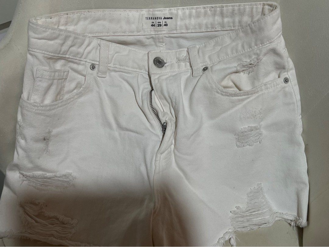 Terranova Jeans White Distressed Denim Shorts (Category: Shorts) located in Las Pinas. Submitted by reiclutter (Listing ID 1461293375, Image 2). Description: - Brand: Terranova Jeans - Color: White Denim - Style: Distressed with rips and frayed hem - Features: Classic five-pocket style, button and zip closure - Condition: Barely used. Too big on me..