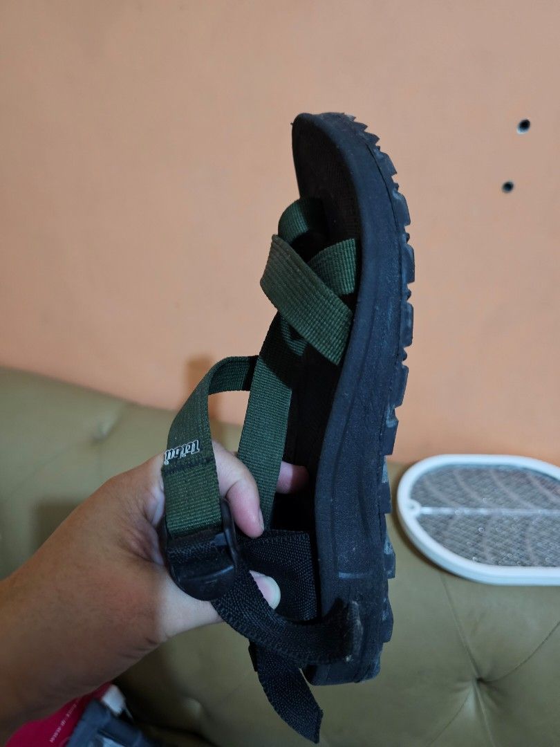 Teva Sandals - Olive Green & Black (Category: Flats & Sandals) located in Manila. Submitted by sinnig (Listing ID 1461129305, Image 2). Description: - Teva Sandals in Olive Green and Black - Adjustable straps for a secure and customized fit - Durable sole built for longevity - Ideal for hiking adventures or everyday wear - Offers both comfort and practicality.