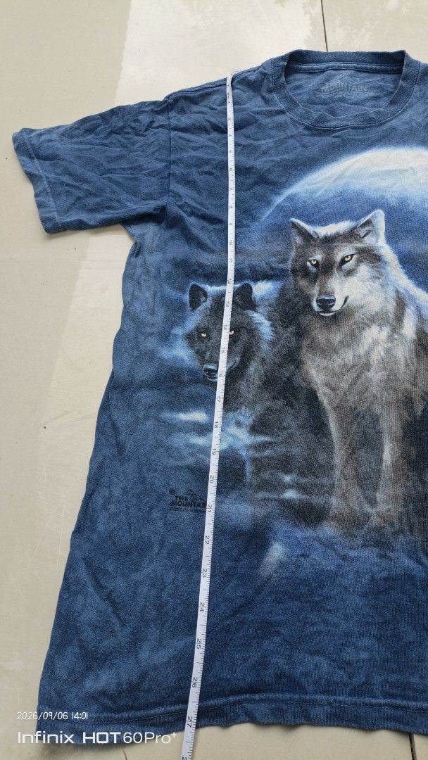 The Mountain Wolf Pack T-Shirt (Category: Tshirts & Polo Shirts ) located in Manila. Submitted by treblig. (Listing ID 1461240313, Image 3). Description: - Cool blue tie-dye t-shirt - Features a striking wolf pack graphic under a moonlit sky - Authentic The Mountain brand - Size S - Ideal for casual wear.