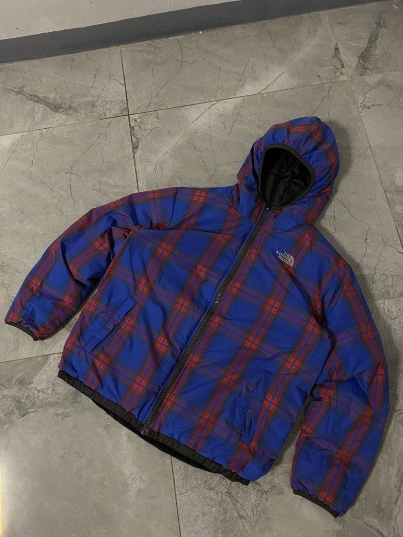 The North Face Reversible Puffer Jacket Black Plaid (Category: Coats, Jackets and Outerwear) located in Manila. Submitted by fastgem-26658b (Listing ID 1461128196, Image 3). Description: - Reversible North Face puffer jacket - Black on one side, blue and red plaid on the other - Hooded design - Full zip-up front closure - Two pockets on each side - Ideal for staying warm in cold weather.