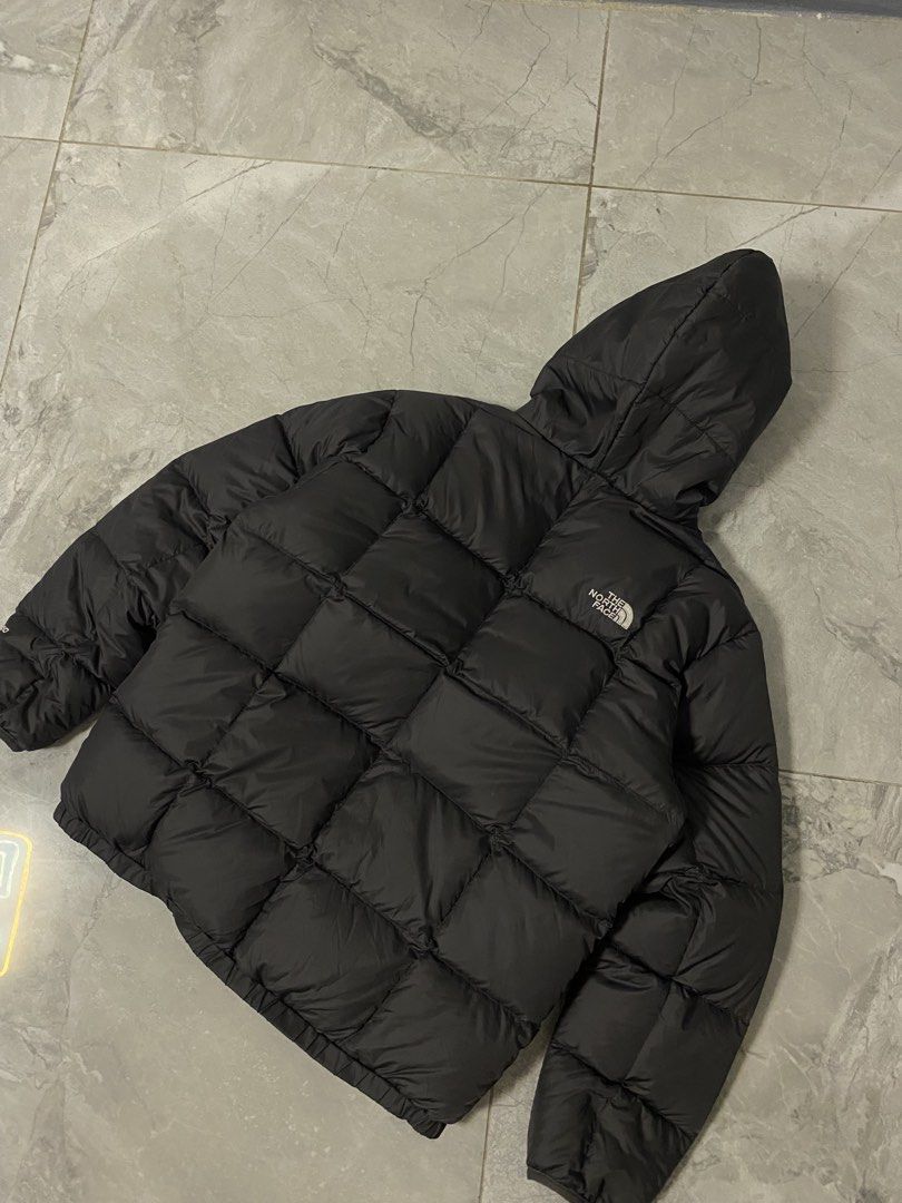 The North Face Reversible Puffer Jacket Black Plaid (Category: Coats, Jackets and Outerwear) located in Manila. Submitted by fastgem-26658b (Listing ID 1461128196, Image 2). Description: - Reversible North Face puffer jacket - Black on one side, blue and red plaid on the other - Hooded design - Full zip-up front closure - Two pockets on each side - Ideal for staying warm in cold weather.
