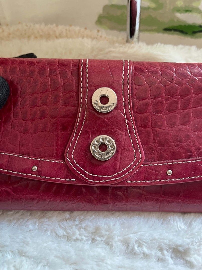Tino Cosma Embossed Wallet with Snap Closure (Category: Wallets & Card holders) located in Naawan. Submitted by twilly.apparel2 (Listing ID 1461155688, Image 2). Description: - issue crack and sign of use Chic red wallet with a sophisticated croc-embossed finish. - Secure snap closure keeps your belongings safe. - Ample card slots to hold all your essential cards. - Convenient zippered compartment for coins or small items. - Interior lining featu