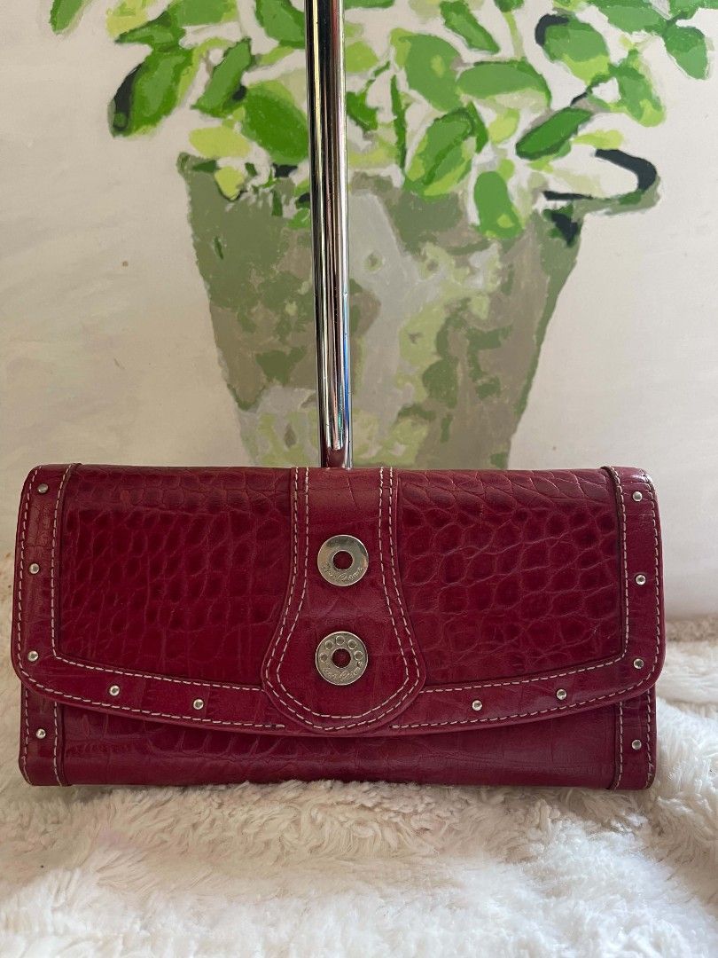 Tino Cosma Embossed Wallet with Snap Closure (Category: Wallets & Card holders) located in Naawan. Submitted by twilly.apparel2 (Listing ID 1461155688, Image 1). Description: - issue crack and sign of use Chic red wallet with a sophisticated croc-embossed finish. - Secure snap closure keeps your belongings safe. - Ample card slots to hold all your essential cards. - Convenient zippered compartment for coins or small items. - Interior lining featu