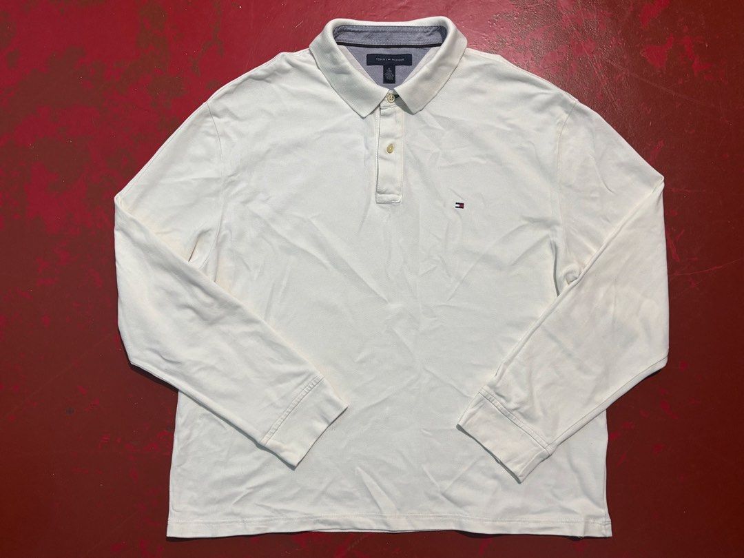 Tommy Hilfiger Mens Longsleeves (Category: Tshirts & Polo Shirts ) located in Manila. Submitted by tindero_ng_ano (Listing ID 1461246149, Image 1). Description: Tommy Hilfiger Mens Longsleeves Size on tag: US XL Men’s Dimensions: -Width (Pit to Pit): 25” -Length: 28” (Please note: Item has been altered/shortened from its original length) -Sleeves Length: 26.5” -Shoulder Width: 23.5” -Color Rate: 9/10 -Condition: Used trice -ISSUE: 2 pinholes (see