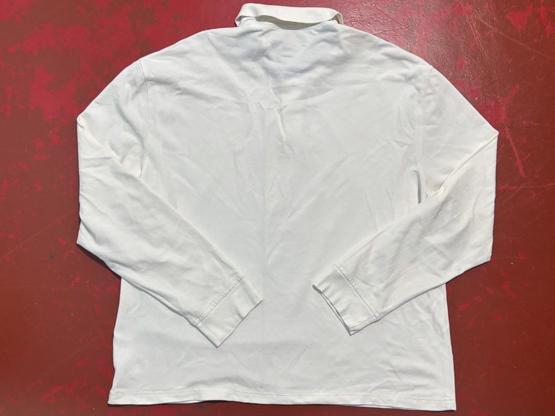 Tommy Hilfiger Mens Longsleeves (Category: Tshirts & Polo Shirts ) located in Manila. Submitted by tindero_ng_ano (Listing ID 1461246149, Image 2). Description: Tommy Hilfiger Mens Longsleeves Size on tag: US XL Men’s Dimensions: -Width (Pit to Pit): 25” -Length: 28” (Please note: Item has been altered/shortened from its original length) -Sleeves Length: 26.5” -Shoulder Width: 23.5” -Color Rate: 9/10 -Condition: Used trice -ISSUE: 2 pinholes (see