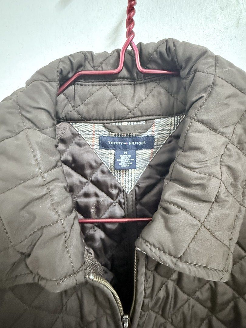 Tommy Hilfiger Quilted Jacket Size M (Category: Coats, Jackets and Outerwear) located in Mandaluyong City. Submitted by sandarah (Listing ID 1461256327, Image 3). Description: - Brown quilted jacket - Brand: Tommy Hilfiger - Size: Medium (M) - Classic, versatile style - Zip-up front - Features pockets - Ideal for layering and cooler weather - Made in China.