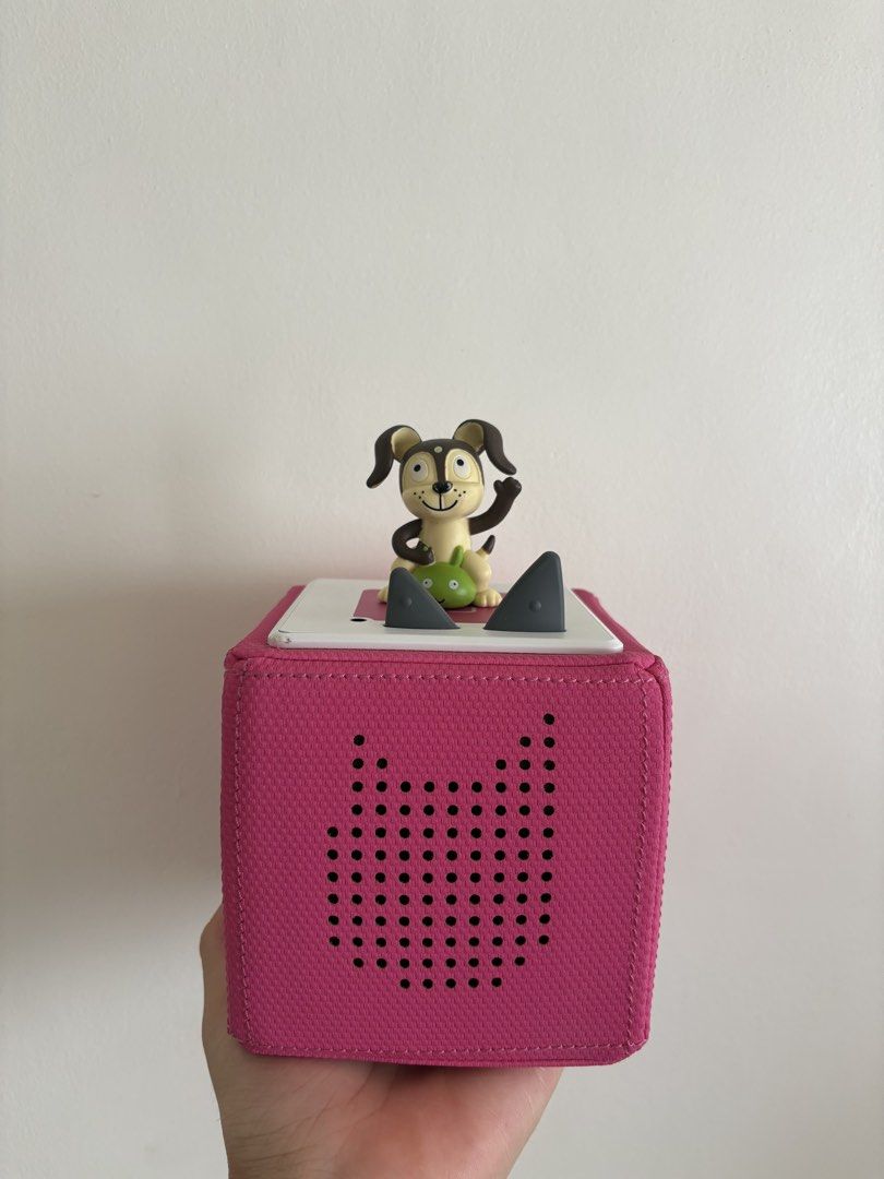 Toniebox 1 Pink Audio Player (Category: Infant Playtime) located in Muntinlupa City. Submitted by prebynik (Listing ID 1461210066, Image 1). Description: - Pink Toniebox audio player - Includes cute dog figure topper - Features a fun dot pattern speaker - Perfect for kids' stories and music - Tested and confirmed working - Ready for a new home.