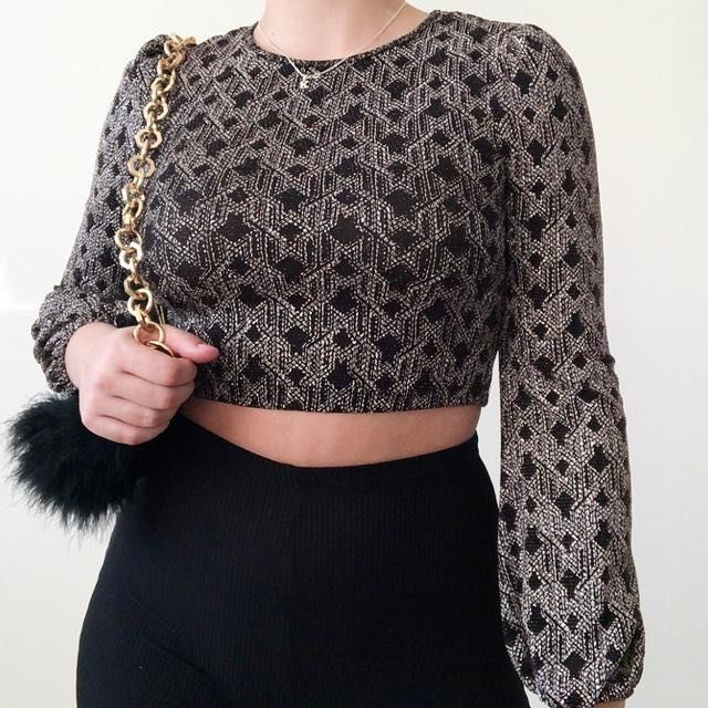 Topshop full sleeves crop top (Category: Blouses) located in Makati City. Submitted by cleaning.my.closet (Listing ID 1461288564, Image 2). Description: Chic black and gold geometric crop top with long sleeves and gathered cuffs. Worn once only. .