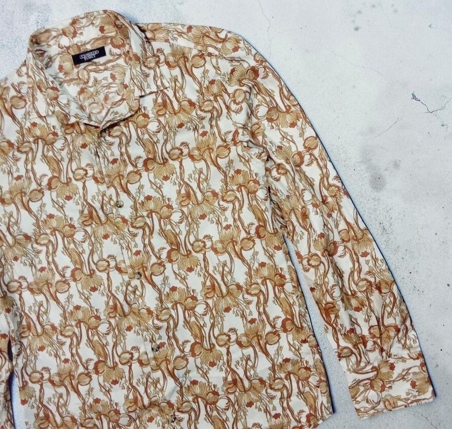 TORNADO MART FLORAL BUTTON DOWN SHORT LONGSLEEVE (Category: Formal Shirts) located in Manila. Submitted by kinstugi.pieces (Listing ID 1461291974, Image 3). Description: Dimes: Width 19 inches Shoulder 17 Sleeve Length 25 Length 28 Hem 19 Origin: Japan Materials: Silk 100% Authentic Minimal Stitching Sep. Color Rate: 10-10 Condition: 10-10 Presentable to Use Add Shipping fee.