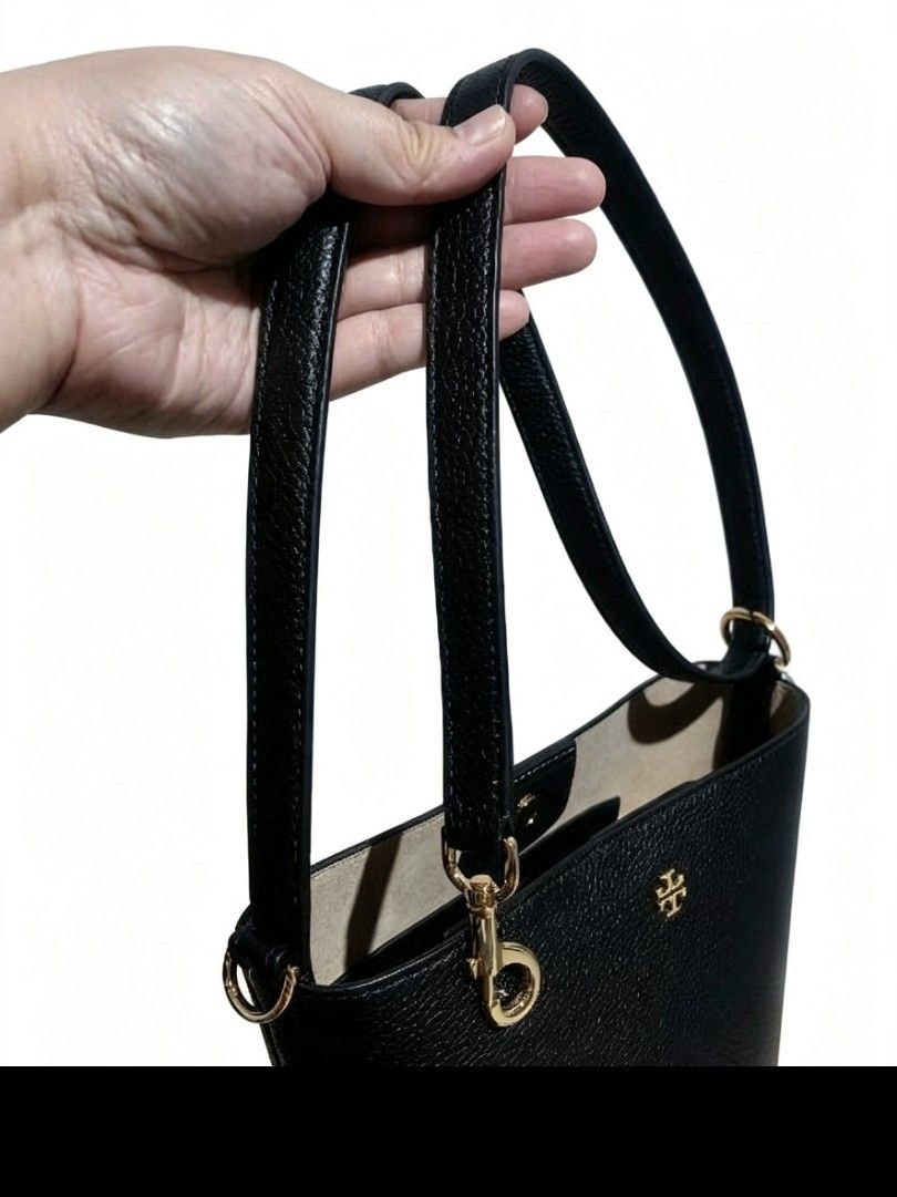 Tory Burch Black Leather Bucket Bag (Category: Luxury Bags & Wallets) located in Valenzuela. Submitted by miracle0326 (Listing ID 1461271864, Image 3). Description: - Classic black leather bucket bag by Tory Burch - Features a pebbled leather finish - Elegant gold hardware details - Adjustable strap for comfortable wear - Comes with original packaging and tags - Style Number: 159490 - Size: OS - Color: Black.