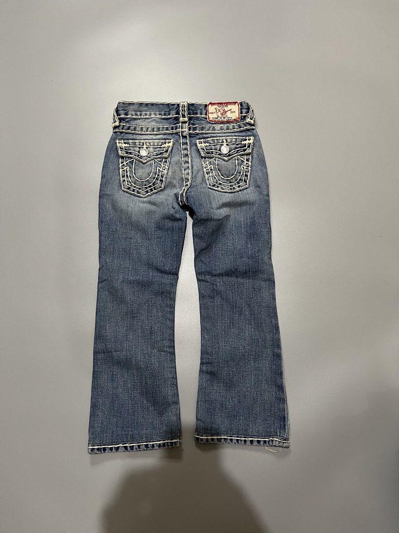 True Religion Kids Jeans Size 5 (Category: Babies & Kids Fashion) located in Manila. Submitted by jorgemabelin2001 (Listing ID 1461129302, Image 1). Description: - Kids True Religion Jeans - Classic blue denim with white stitching - Iconic horseshoe logo on back pockets - Button and zip fly closure - Features stylish distressed details on the front - Ideal for comfortable everyday wear -22x27.