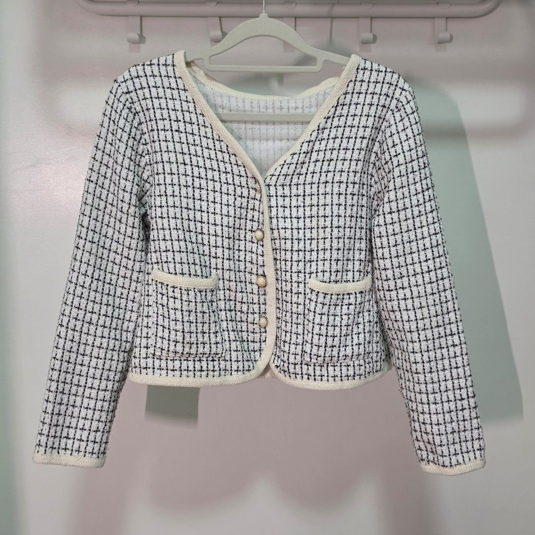 Tweed Cropped Jacket with Gold Buttons (Category: Coats, Jackets and Outerwear) located in Mandaluyong City. Submitted by Llyssa12 (Listing ID 1461243933, Image 1). Description: - Black and white tweed cropped jacket - Classic checkered pattern - Cream trim along edges and pockets - Gold button details on front and pockets - Long sleeves - Versatile layering piece for jeans or skirts -Shipping is shouldered by the buyer.
