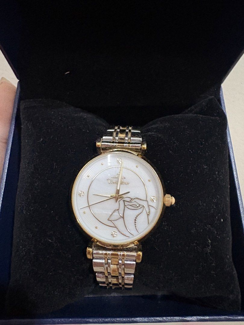 UniSilver Time Watch with Rose accent (Category: Women's Watches) located in Manila. Submitted by alyannaros79007 (Listing ID 1461259707, Image 1). Description: - UniSilver Time watch - White dial with elegant gold accents - Two-tone silver and gold bracelet - Needs Battery - Japan Movement - Comes with original box and guarantee card - Extra links included for a perfect fit - Features a unique design on the watch face - Versatile for everyday we