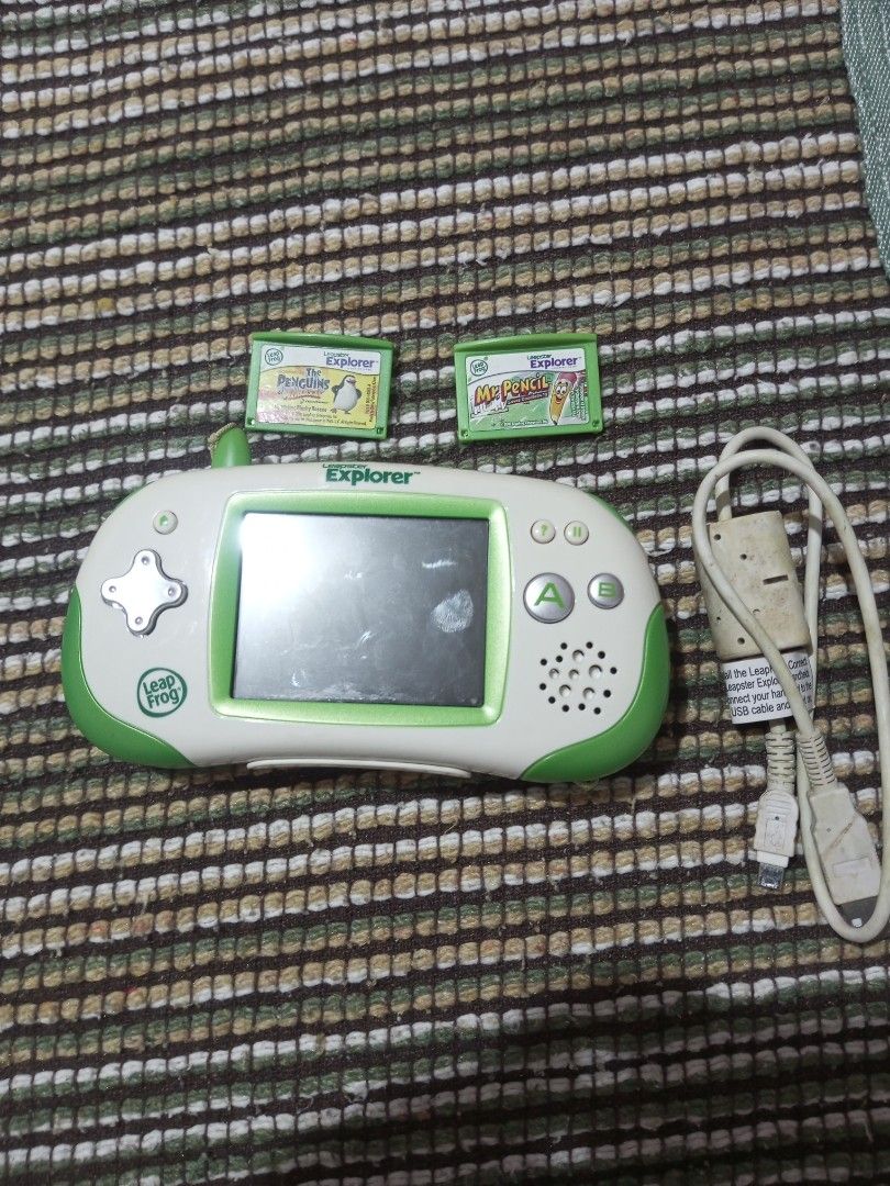 (Untested)LeapFrog Explorer Handheld Learning Game System with 2 Games (Category: Educational & Learning Toys) located in Caloocan City. Submitted by tobylacua26871 (Listing ID 1461248908, Image 1). Description: -(Untested get as is) - LeapFrog Explorer handheld learning system - Includes device, USB cable, and 2 game cartridges - Games included: 'Mr. Pencil' and 'Penguins' - Features interactive screen and buttons for engaging play - Perfect for