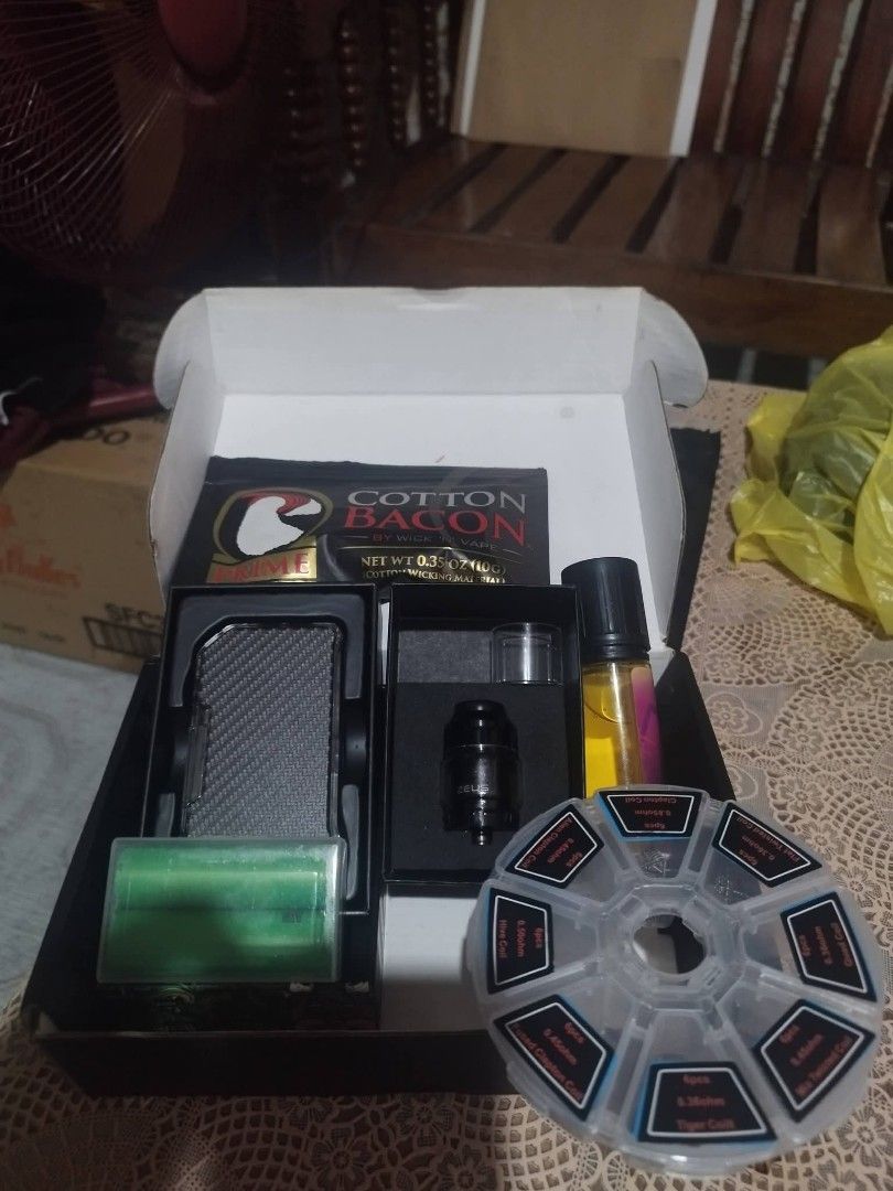 Vape Mod Kit with Cotton Bacon and Coils (Category: Other Gadgets) located in Marikina City. Submitted by yoitschaniee (Listing ID 1461202304, Image 1). Description: - Sleek carbon fiber finish vape mod kit - Includes Cotton Bacon for easy wicking - Pre-built coils for convenience - Bottle of e-liquid to get you started - Matching tank with spare glass included - Ideal for new vapers or those upgrading - All items are brand new in the box.