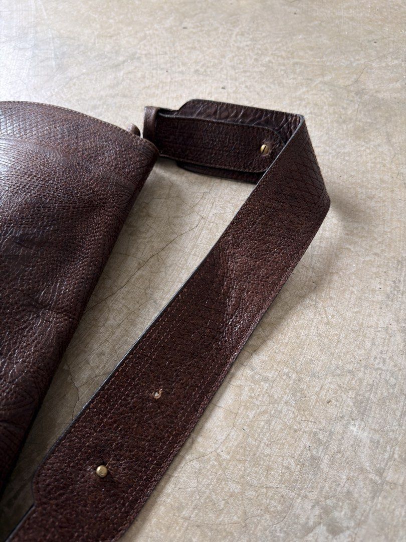 vintage Kenzo brown embossed leather shoulder bag (Category: Shoulder Bags) located in Alfonso. Submitted by jbcamet (Listing ID 1461282949, Image 3). Description: - Genuine brown leather shoulder bag - Unique all-over embossed pattern - Adjustable strap with brass hardware - Secure button tab flap closure - Spacious main compartment - Perfect for daily use.