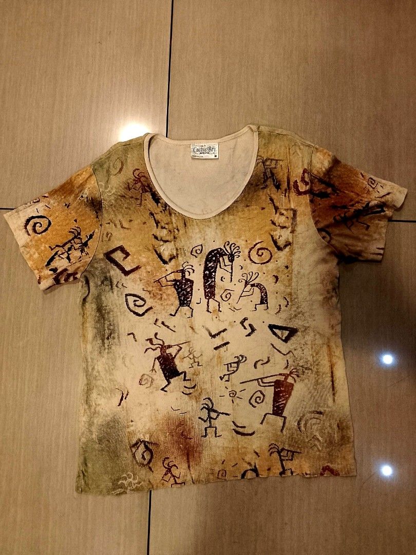 Vintage Native American petroglyph print (Category: Shirts) located in Manila. Submitted by newage.vintage (Listing ID 1461142024, Image 2). Description: - made in USA - 100% cotton - all over print - print: Kokopelli or rock art symbols - excellent condition - 90's era.