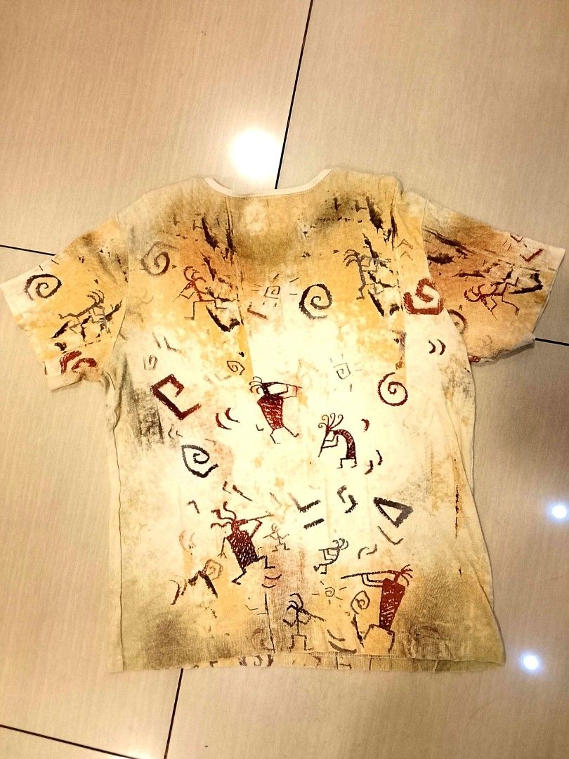 Vintage Native American petroglyph print (Category: Shirts) located in Manila. Submitted by newage.vintage (Listing ID 1461142024, Image 3). Description: - made in USA - 100% cotton - all over print - print: Kokopelli or rock art symbols - excellent condition - 90's era.