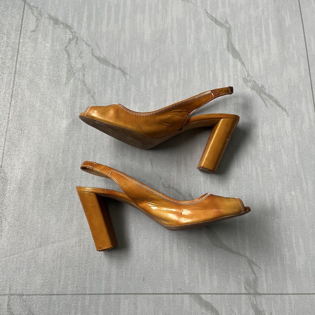 Vintage Prada Leather Peep-Toe Slingback Heels (Authentic) (Category: Heels) located in Cavite. Submitted by newclassicwear (Listing ID 1461207188, Image 1). Description: Size 38 Used Excellent Condition Used But Not Abused (minor scuffs on heels and soles from normal wear plenty of life left) - Brand: Prada - Material: Brown Patent Leather - Style: Slingback Heels - Toe Style: Peep-toe - Heel Type: Chunky Block Heel - Condition: Minor scuffs on 