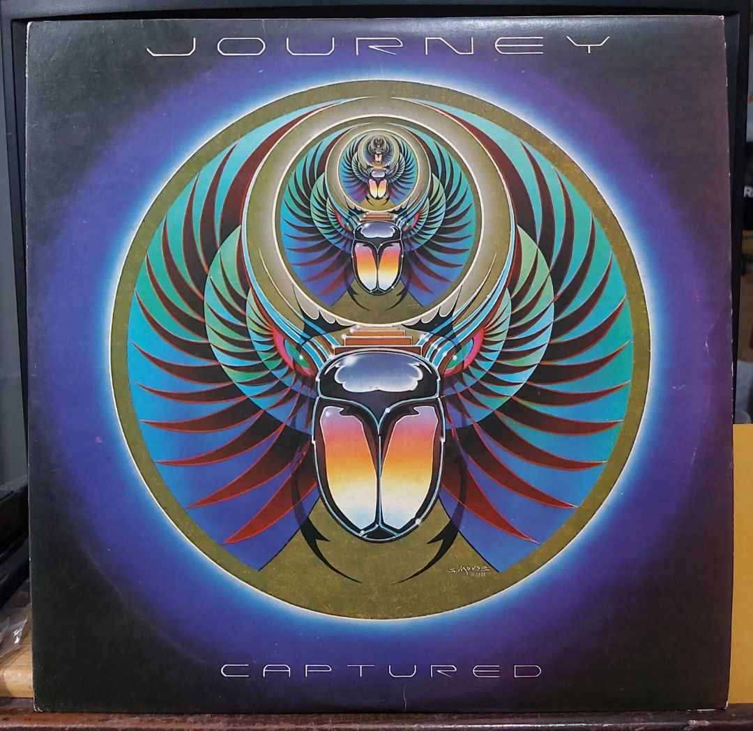 vinyl Journey - Captured 2LPs (open) (Category: Vinyls) located in Antipolo. Submitted by rlt1870 (Listing ID 1461153786, Image 1). Description: 2 pcs. records and cover in good condition. light scratches no skips. local vinyl. - Features iconic album art on the front - Band photo on the back - Includes all tracks listed on the back cover - Essential for any Journey fan's collection Antipolo Rizal.