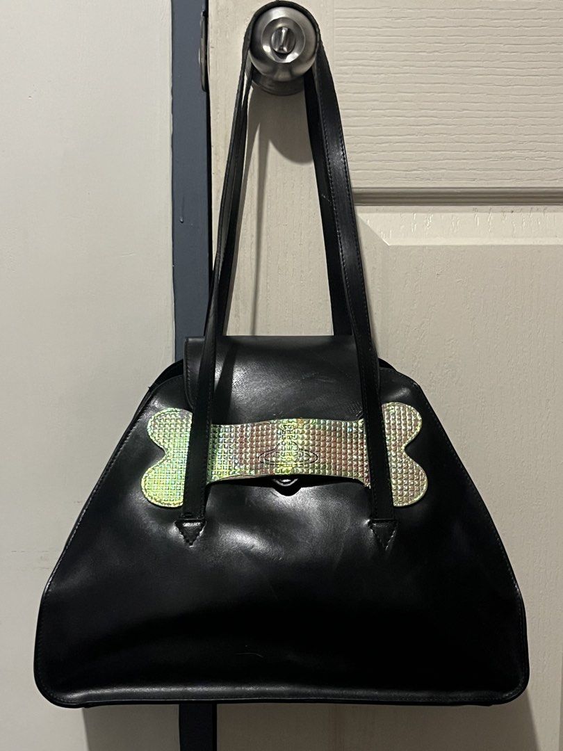 Vivienne Westwood Dogbone Bowling Bag (Category: Luxury Bags & Wallets) located in Baguio. Submitted by vintagegurlie (Listing ID 1461262539, Image 1). Description: Black leather material, very nice as a shoulder bag since long handles. Yes, it is good for work/school. All details posted First to pay.