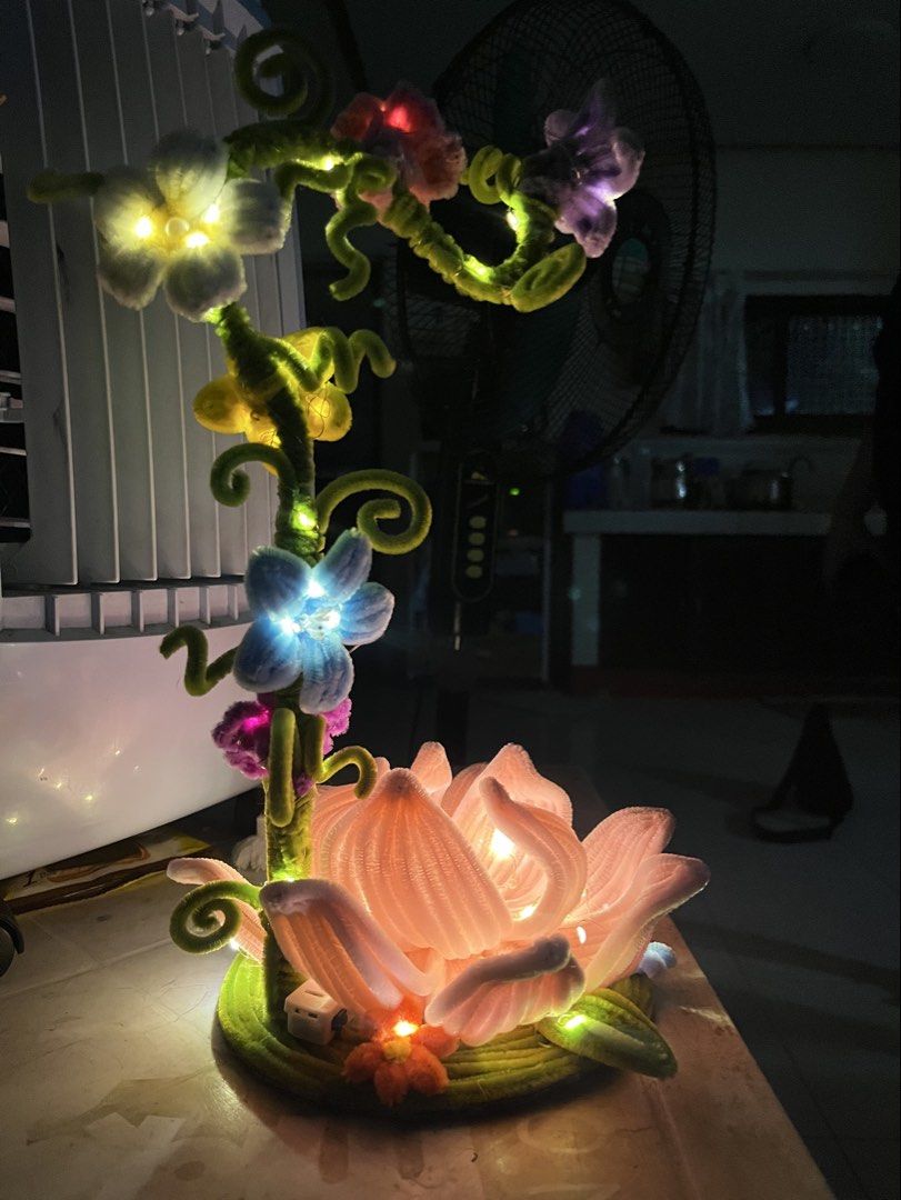 Whimsy flower lamp (Category: Handmade Craft) located in Manila. Submitted by rikhooo (Listing ID 1461318600, Image 2). Description: Whimsy flower lamp made from fuzzy wires/pipe cleaners. Made to order!💕 But would accept rush orders with price negotiations🥰 Lights are LED fairy lights but can be modified! .