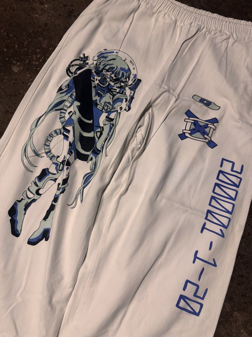 White Anime Graphic Wide Leg Pants (Category: Other Bottoms) located in Pasig City. Submitted by dripthrift1600 (Listing ID 1461258701, Image 3). Description: - Trendy white pants with eye-catching anime graphics. - One leg features a full-body character design. - The other leg showcases a cool mechanical design. - Comfortable elastic waistband for a perfect fit. - Stylish wide-leg silhouette. - Ideal for casual outings or making a bold fashion s