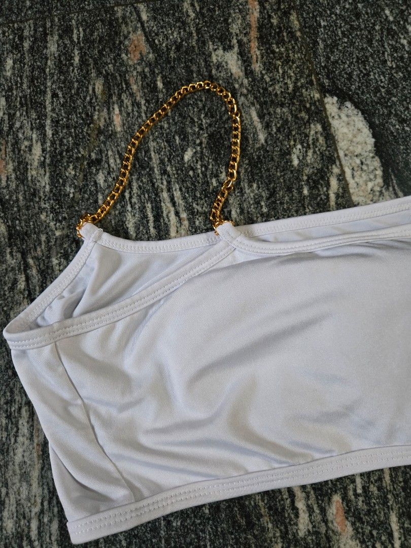 White Bikini Set with Gold Chain Detail (Category: Bikinis & Swimsuits) located in Las Pinas. Submitted by juliagarcia95 (Listing ID 1461169543, Image 2). Description: - Stylish white bikini set - Features elegant gold chain accents on straps - Halter neck top design - Flattering high-waisted bottom - Made with stretchy material for comfort - Ideal for beach trips and pool days.