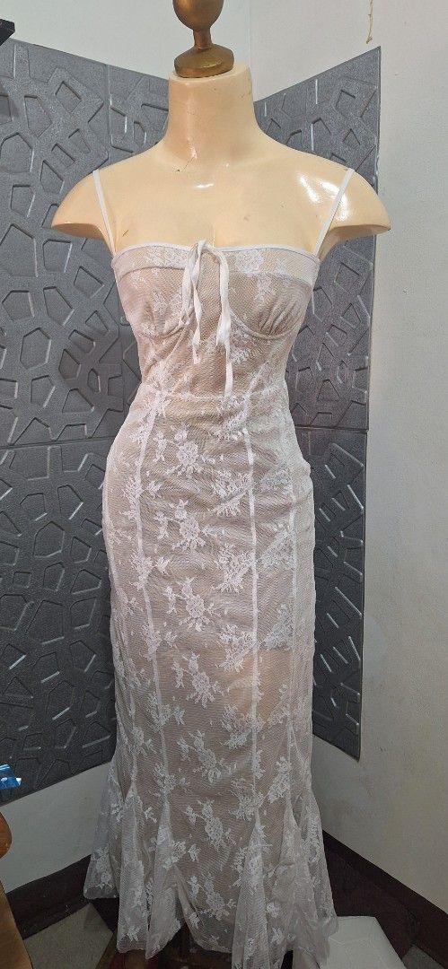 White Lace Maxi Dress with Spaghetti Straps (Category: Dresses) located in Manila. Submitted by chavezmade78698 (Listing ID 1461189369, Image 1). Description: - Beautiful white lace maxi dress - Delicate floral lace overlay - Spaghetti straps and sweetheart neckline - Ties at the front - Flattering mermaid hem with a slit - Ideal for special occasions or a night out.