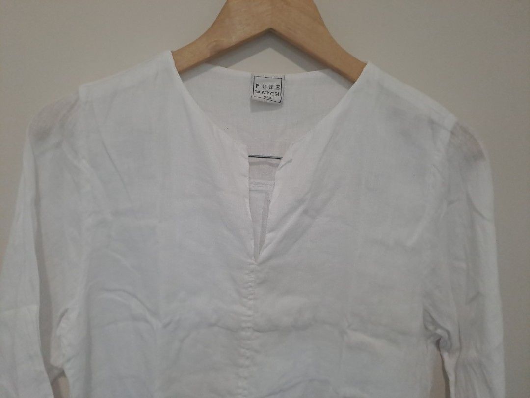 White Linen Tunic dress (Category: Longsleeves) located in Manila. Submitted by joanbalde39643 (Listing ID 1461231876, Image 2). Description: This garment is a women's white linen tunic blouse, featuring a relaxed fit, a split V-neckline, and versatile three-quarter length sleeves..