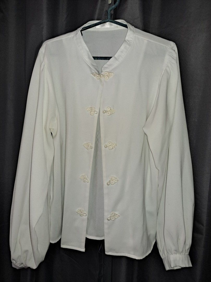 White Long Sleeve Blouse with Embroidered Details (Category: Blouses) located in Cabuyao City. Submitted by _closetbysue (Listing ID 1461139629, Image 1). Description: - White long sleeve blouse - Delicate embroidery on the front - Button-up style - Versatile for layering or standalone wear.