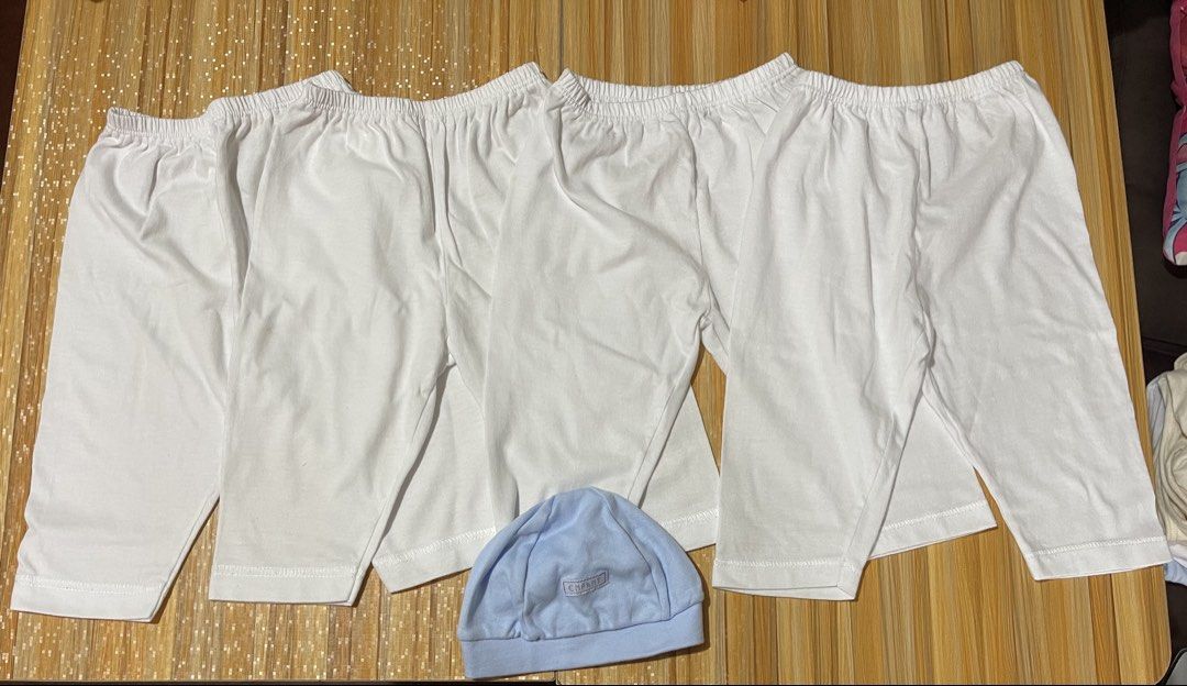 White Pajamas with free Blue Hat (Category: Babies & Kids Fashion) located in Manila. Submitted by chogarcookie (Listing ID 1461205405, Image 1). Description: - Set of 4 white baby pajamas - Made from soft, breathable cotton - Features comfortable elastic waistbands - Comes with 1 light blue baby hat - Hat has 'Enfant' logo detail - Ideal for everyday wear and sleeping.