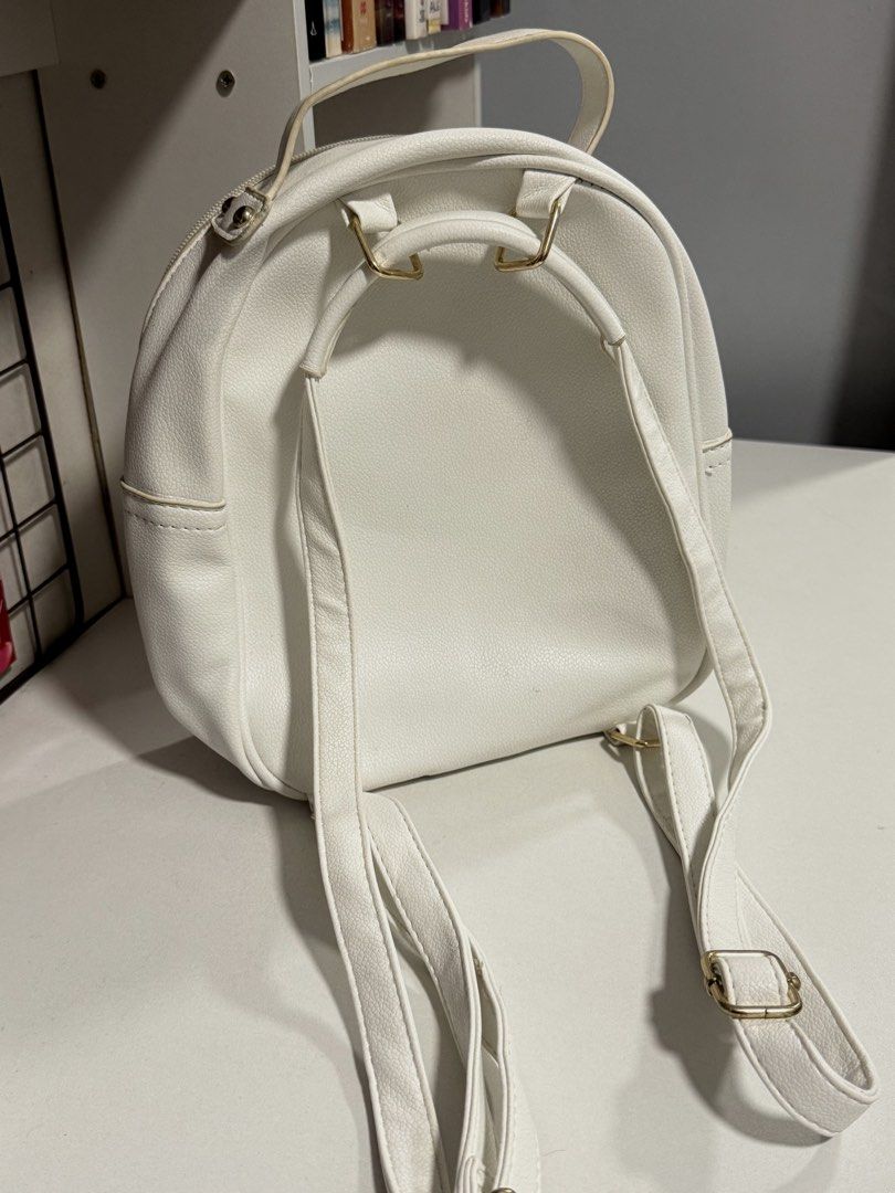 White Quilted Mini Backpack (Category: Backpacks) located in Cavite. Submitted by prelvds_ (Listing ID 1461277023, Image 3). Description: - Used this ONCE last year - Light yellow stains on the handle - No (visible) damages - Can fit up to 3 notebooks - Small but spacious .