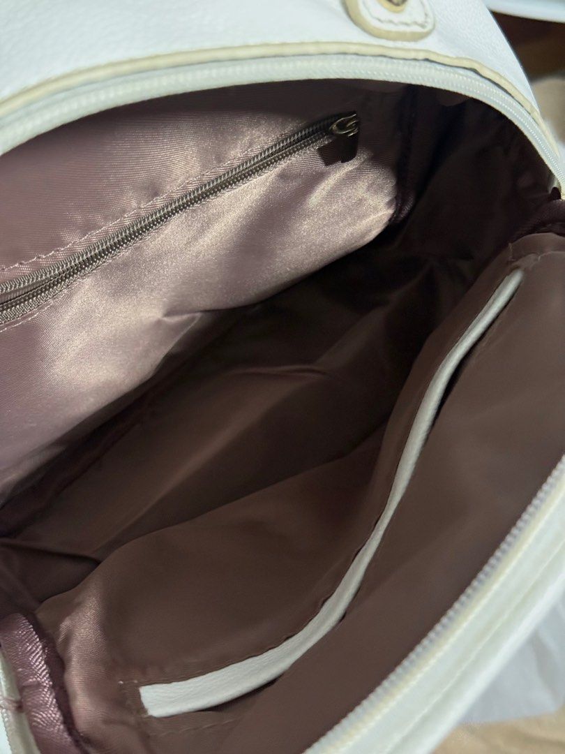White Quilted Mini Backpack (Category: Backpacks) located in Cavite. Submitted by prelvds_ (Listing ID 1461277023, Image 2). Description: - Used this ONCE last year - Light yellow stains on the handle - No (visible) damages - Can fit up to 3 notebooks - Small but spacious .