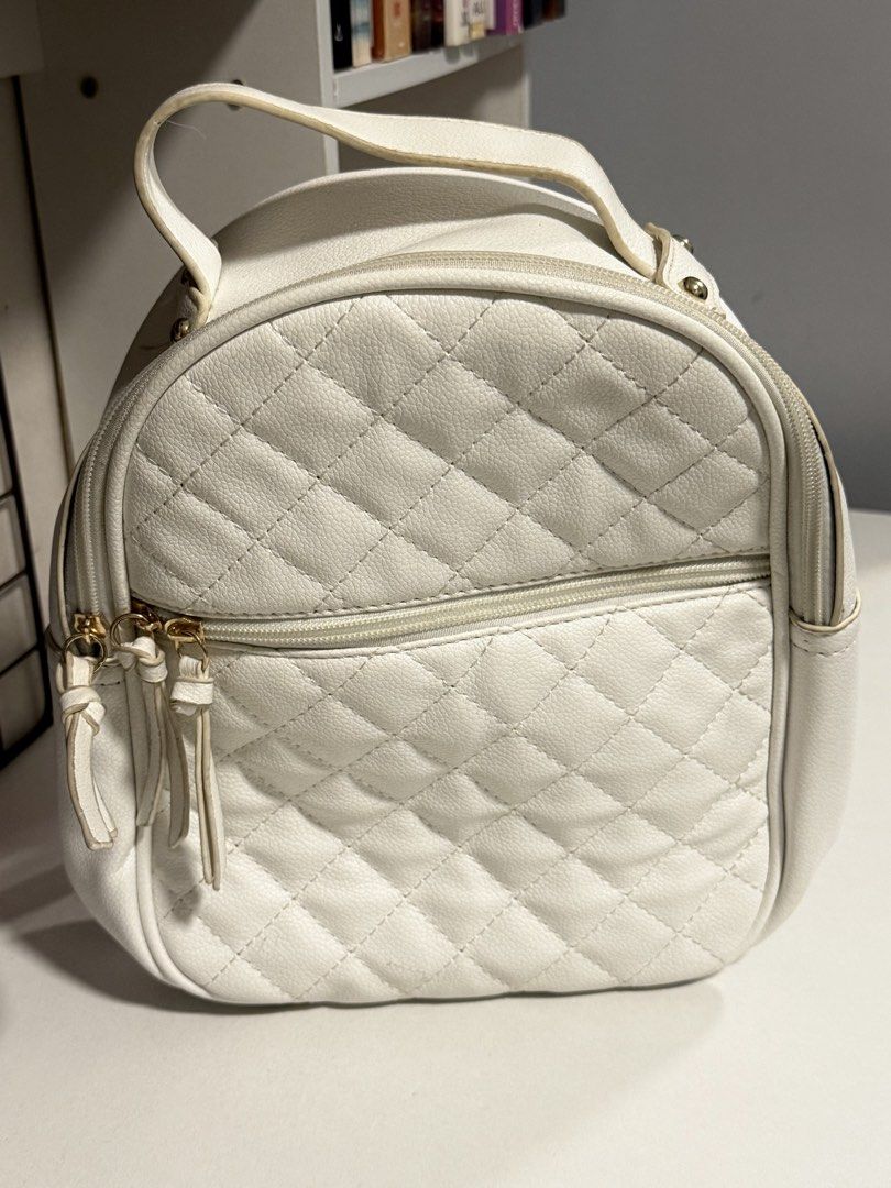 White Quilted Mini Backpack (Category: Backpacks) located in Cavite. Submitted by prelvds_ (Listing ID 1461277023, Image 1). Description: - Used this ONCE last year - Light yellow stains on the handle - No (visible) damages - Can fit up to 3 notebooks - Small but spacious .