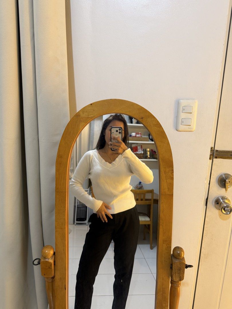 White Ribbed V-Neck Long Sleeve Top (Category: Longsleeves) located in Mandaluyong City. Submitted by chocofudge__ (Listing ID 1461153336, Image 2). Description: - White ribbed long-sleeve top - Flattering V-neckline - Stretchy material for comfort - Perfect for tucking in or wearing out - Ideal for layering or wearing solo - A versatile addition to any wardrobe.