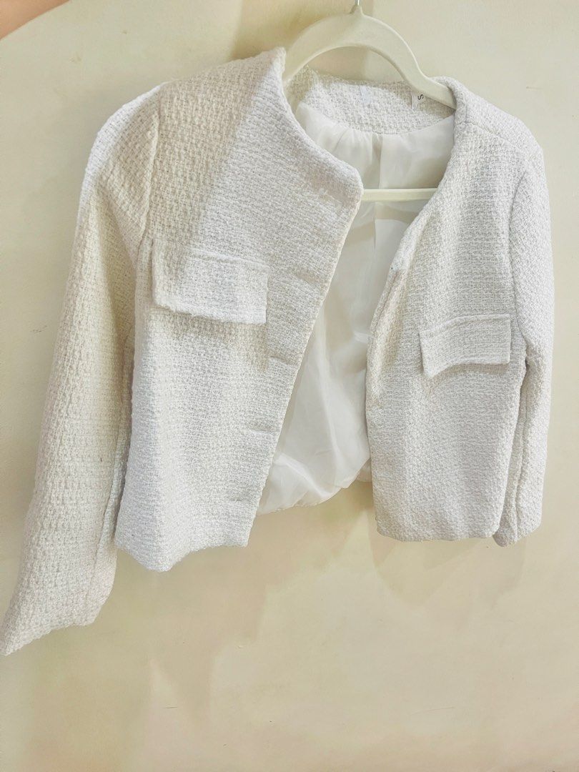 White Tweed Jacket Blazer (Category: Coats, Jackets and Outerwear) located in Quezon City. Submitted by prelovedluxe_ (Listing ID 1459933172, Image 2). Description: Elegant and timeless white open style tweed jacket featuring a textured woven finish. Designed with a structured, slightly cropped silhouette, round neckline, long sleeves, and flap pockets for a refined yet versatile look. The jacket is fully lined. Easy to dress up or down—pair it w