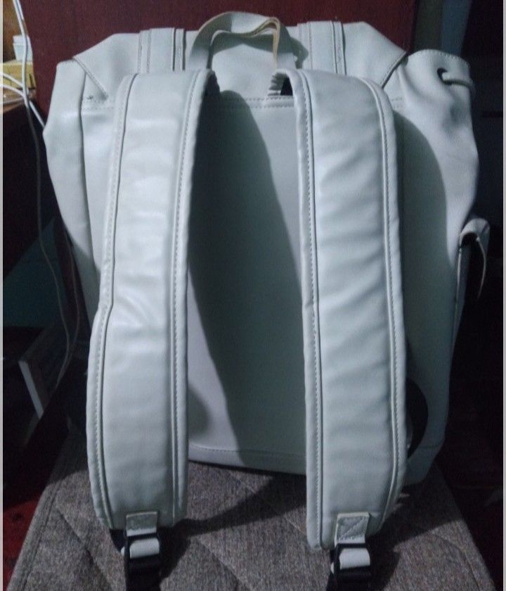White Zara Backpack (Category: Backpacks) located in Manila. Submitted by jayzayne1824 (Listing ID 1461245790, Image 1). Description: - Stylish white backpack from Zara - Secure drawstring closure - Front pockets with decorative buckle details - Interior zippered pocket for essentials - Adjustable straps for comfortable wear - Ideal for everyday errands or your next getaway.