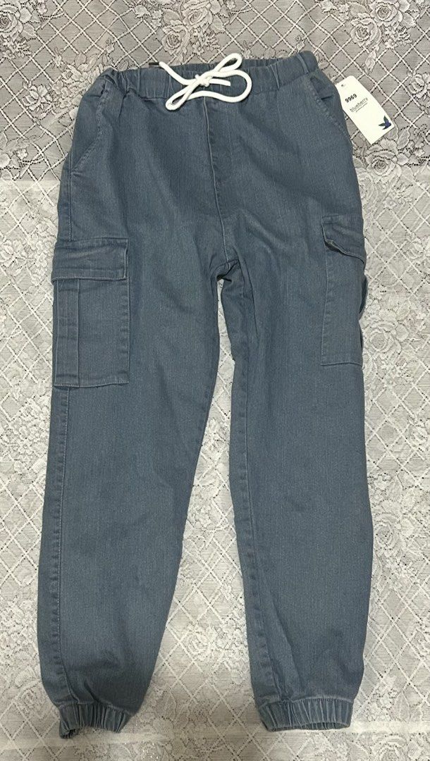 Womens Cargo Jogger Pants new with tag (Category: Jeans) located in Plaridel. Submitted by ilovebubu28 (Listing ID 1461146809, Image 1). Description: - Blue denim jogger pants for kids - Elastic waistband with adjustable drawstring - Two cargo pockets on each leg - Cuffed ankles for a snug fit - Comfortable and casual style, ideal for everyday wear Will fit 28-30 garterized po sya .
