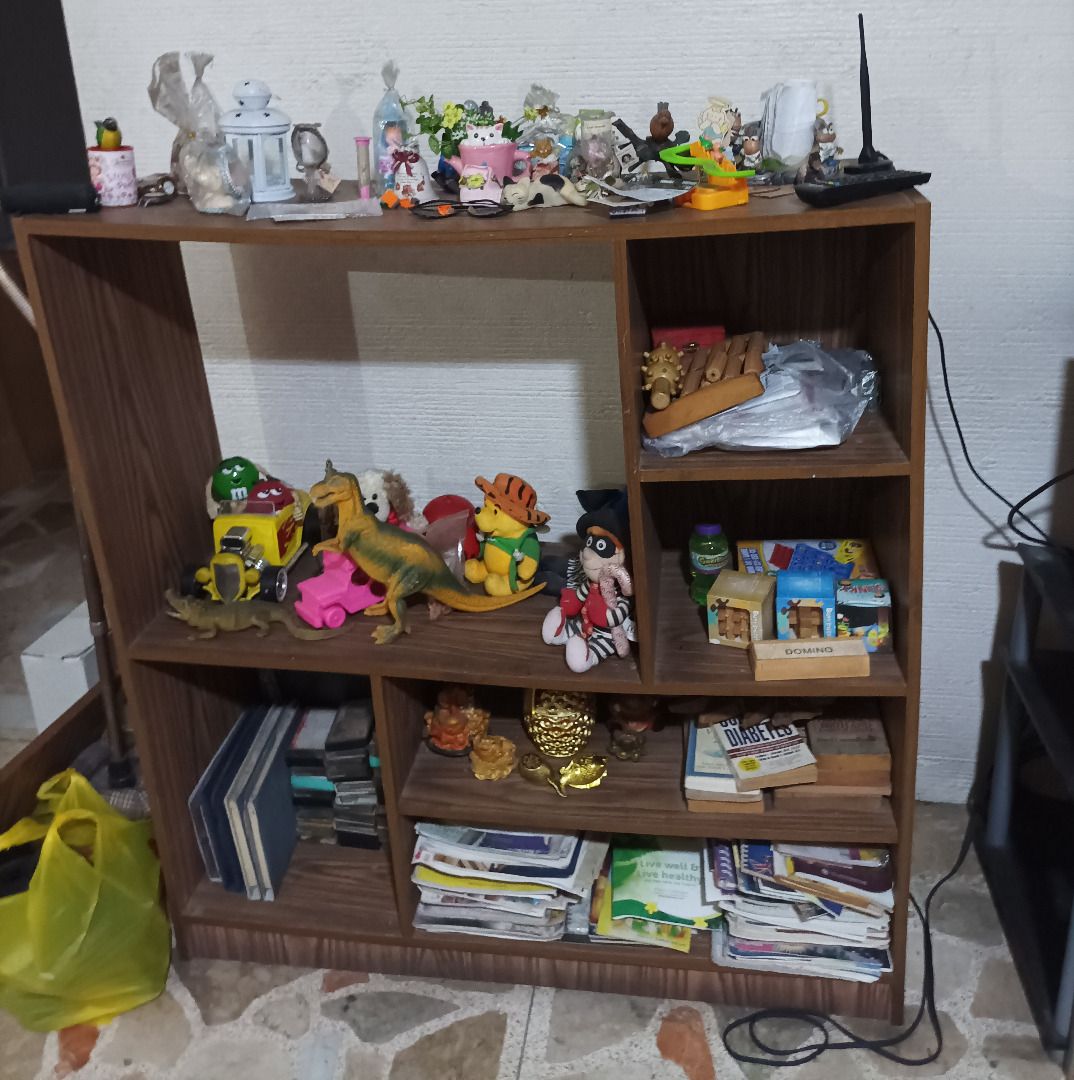 Wooden Display Shelf (Category: Shelves, Cabinets & Racks) located in Pasig City. Submitted by hamilz (Listing ID 1461149763, Image 1). Description: - Wooden display shelf with multiple compartments. - Ideal for organizing and showcasing your personal collection. - All decorative items and books shown in picture are not included. - For pickup only, slightly negotiable upon viewing..