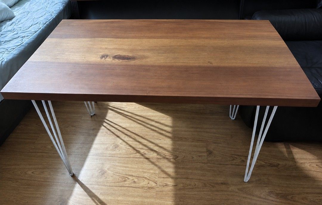 Mahogany Table with Metal Legs (Category: Tables & Sets) located in Paranaque City. Submitted by sk1rtle (Listing ID 1461198620, Image 1). Description: - Solid mahogany wood tabletop with a warm, natural finish - Sturdy metal hairpin legs - Perfect size for dining or as a workspace Material: Solid Mahogany Top, 44mm THK Black Hairpin Legs Dimensions: 24" (D) x 48" (W) x 29" (H).