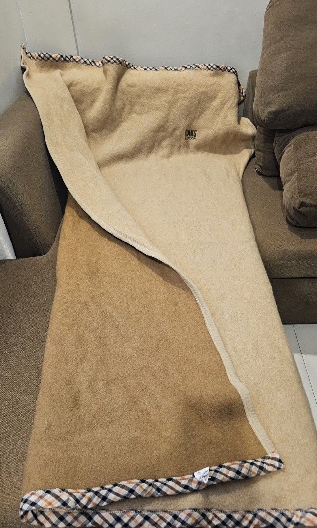 Wool Lap Blanket Beige - DAKS LONDON (Category: Bedding & Towels) located in Quezon City. Submitted by happy.cutie888 (Listing ID 1461261568, Image 2). Description: Beige lap blanket featuring the DAKS LONDON A distinctive checkered border lime Burberry. 140cm x 200cm Brand: DAKS LONDON (British Fashion) Texture: Pure Wool Color: Dual toned - Beige and Brown Design: Checkered border Product type: Lap blanket 777 negotiable price like new - I used