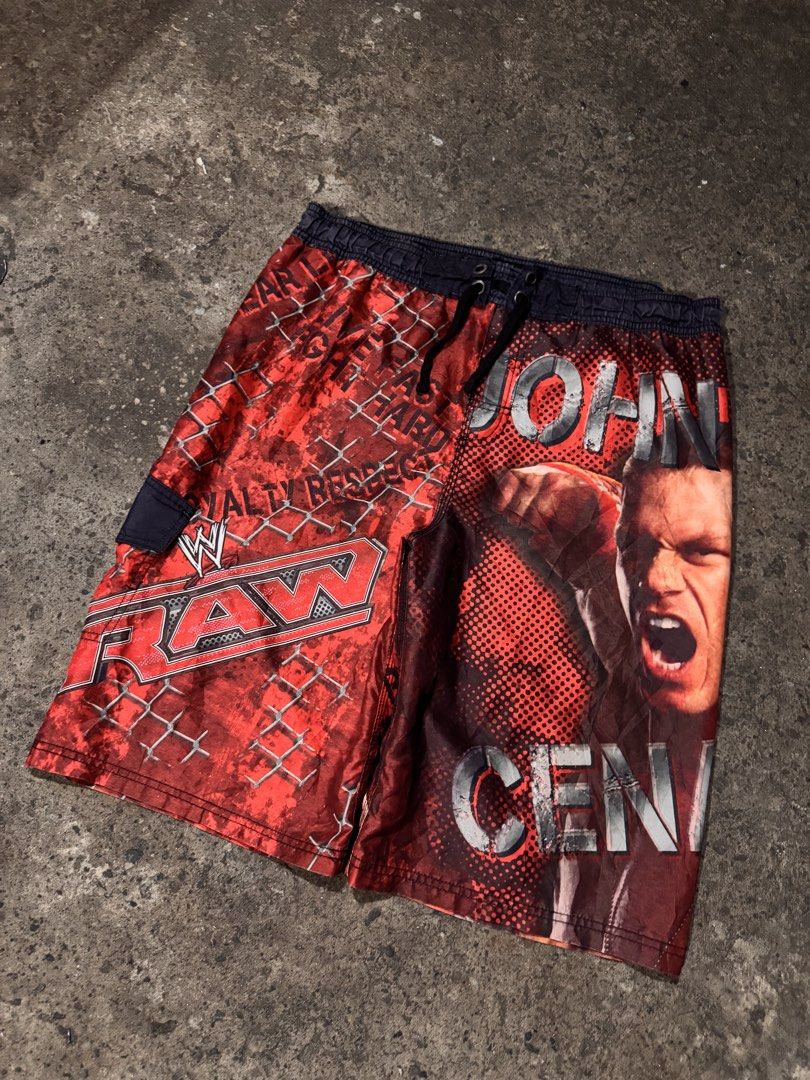 WWE John Cena Raw Swim Shorts (Category: Shorts) located in Pasig City. Submitted by dripthrift1600 (Listing ID 1461259515, Image 1). Description: - Awesome WWE swim shorts featuring John Cena and the Raw logo. - Perfect for any wrestling fan. - Elastic waistband with drawstring for a secure and comfortable fit. - Includes a convenient side pocket. - Show off your wrestling pride at the beach or pool. - John Cena Board Short - Excellent Condition
