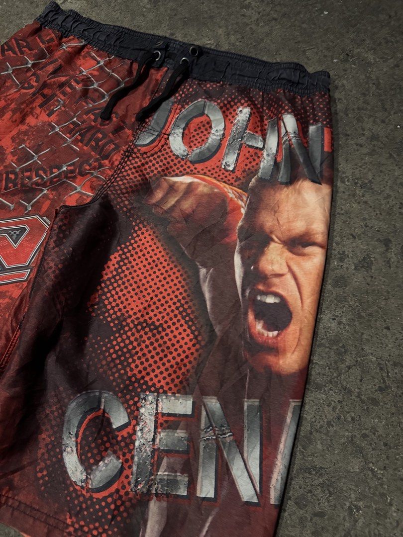 WWE John Cena Raw Swim Shorts (Category: Shorts) located in Pasig City. Submitted by dripthrift1600 (Listing ID 1461259515, Image 3). Description: - Awesome WWE swim shorts featuring John Cena and the Raw logo. - Perfect for any wrestling fan. - Elastic waistband with drawstring for a secure and comfortable fit. - Includes a convenient side pocket. - Show off your wrestling pride at the beach or pool. - John Cena Board Short - Excellent Condition