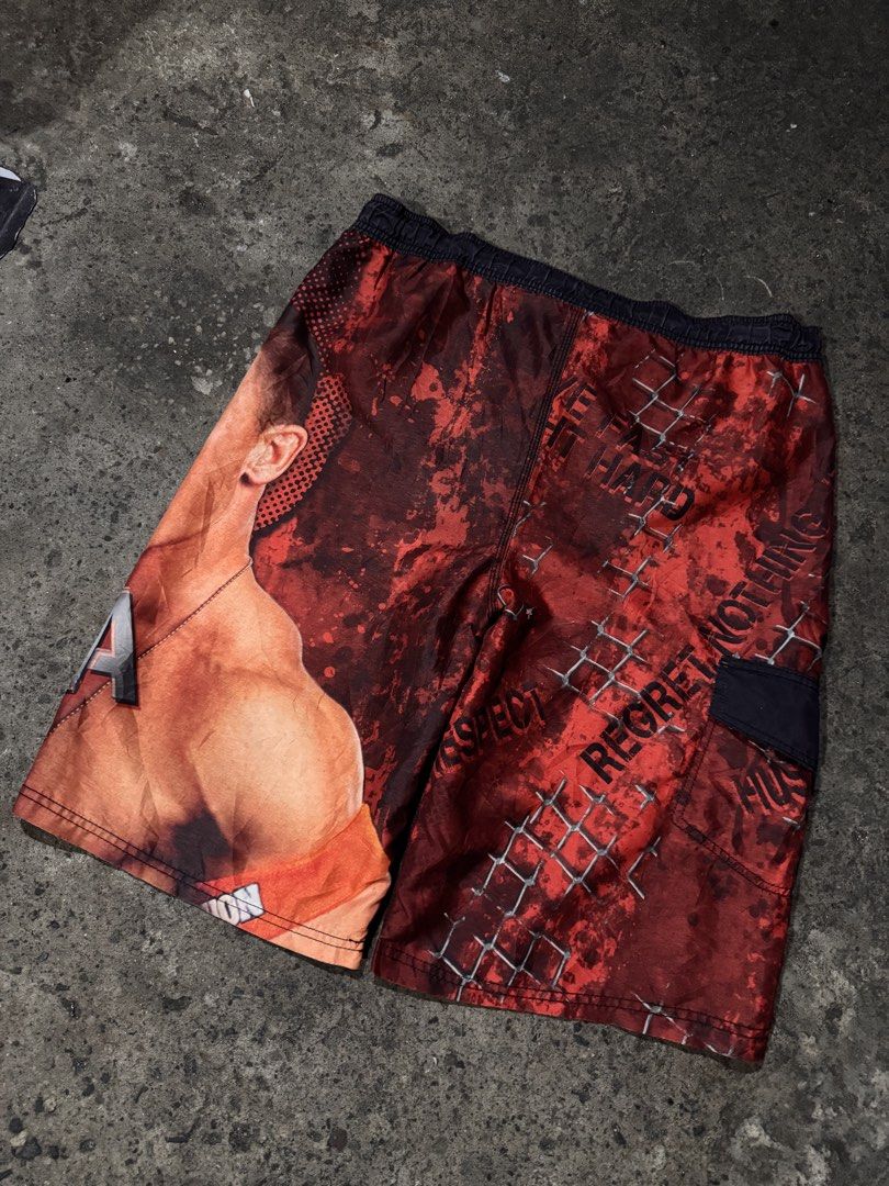 WWE John Cena Raw Swim Shorts (Category: Shorts) located in Pasig City. Submitted by dripthrift1600 (Listing ID 1461259515, Image 2). Description: - Awesome WWE swim shorts featuring John Cena and the Raw logo. - Perfect for any wrestling fan. - Elastic waistband with drawstring for a secure and comfortable fit. - Includes a convenient side pocket. - Show off your wrestling pride at the beach or pool. - John Cena Board Short - Excellent Condition