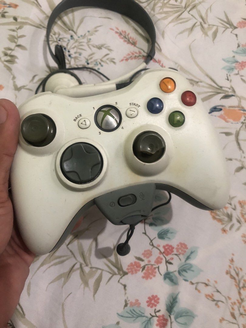 Xbox 360 wireless controller with headset (Category: Controllers) located in Quezon City. Submitted by markgolveo (Listing ID 1461162480, Image 2). Description: Xbox 360 wireless controller with headset Last tested a year ago working properly Missing its adapter wire for charging Worn out analog rubber caps Not sure if battery pack still holds up now lost its charging cable Mic last tested working , mic cable flimsy, missing earfoam Signs of wear