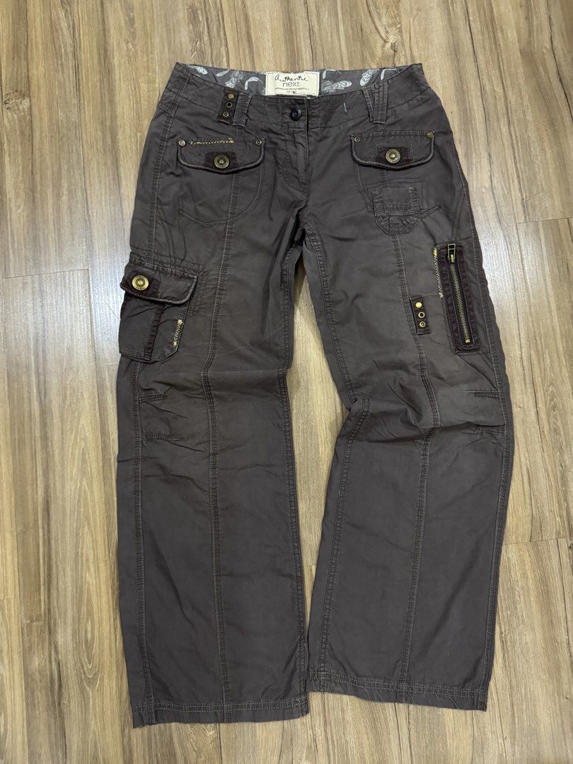 Y2K Lowrise Cargo Pants (Category: Jeans) located in Manila. Submitted by pousey (Listing ID 1461260184, Image 2). Description: - Dark wash cargo pants -Baggy Style - Zip fly and button closure - Distinctive designs such as extra rivets and zipper - Comfortable for everyday wear - Versatile addition to your wardrobe - See Last Slides for dimensions.