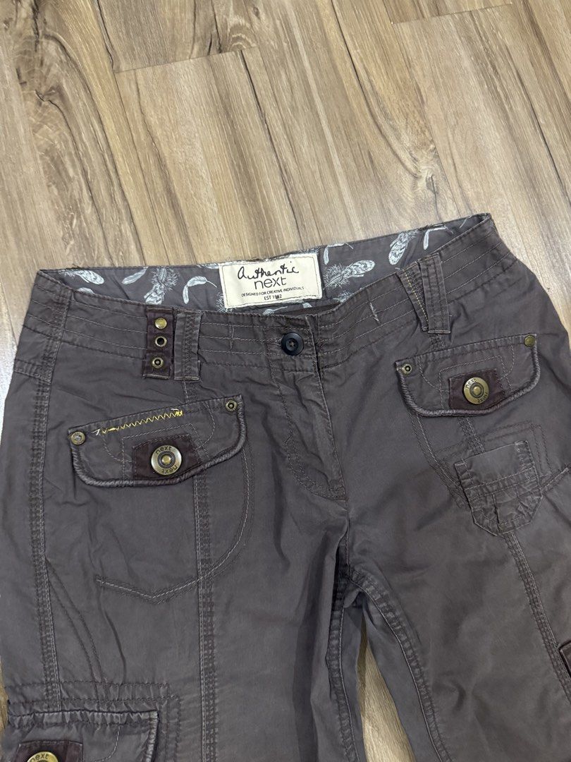 Y2K Lowrise Cargo Pants (Category: Jeans) located in Manila. Submitted by pousey (Listing ID 1461260184, Image 3). Description: - Dark wash cargo pants -Baggy Style - Zip fly and button closure - Distinctive designs such as extra rivets and zipper - Comfortable for everyday wear - Versatile addition to your wardrobe - See Last Slides for dimensions.