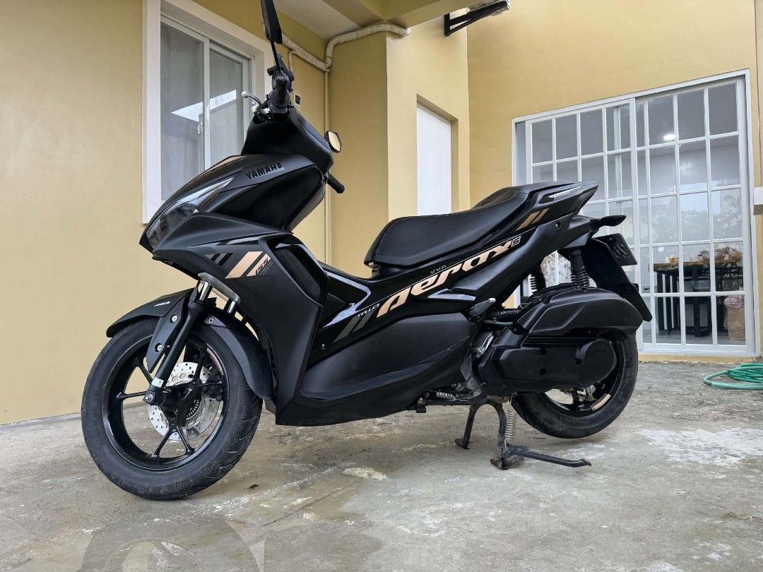 Yamaha Aerox V2 ABS 155 VVA Keyless (Category: Motorbikes for Sale) located in Manila. Submitted by yadordioni08067 (Listing ID 1461319569, Image 1). Description: FOR SALE AEROX V2 ABS 155 VVA (Keyless) 1st owner 📍2021 model 📍2K+ orig odo (low mileage/seldom used) 📍original lto plate 📍complete orig papers 📍all stock 📍issue unregistered/minimal scratches 📍95K PHP Cabanatuan City Location Matte black finish with gold accents. Low mileage and